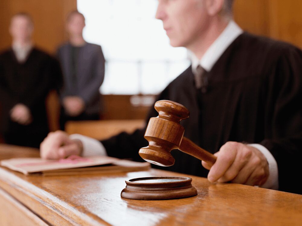Judge striking gavel in courtroom
