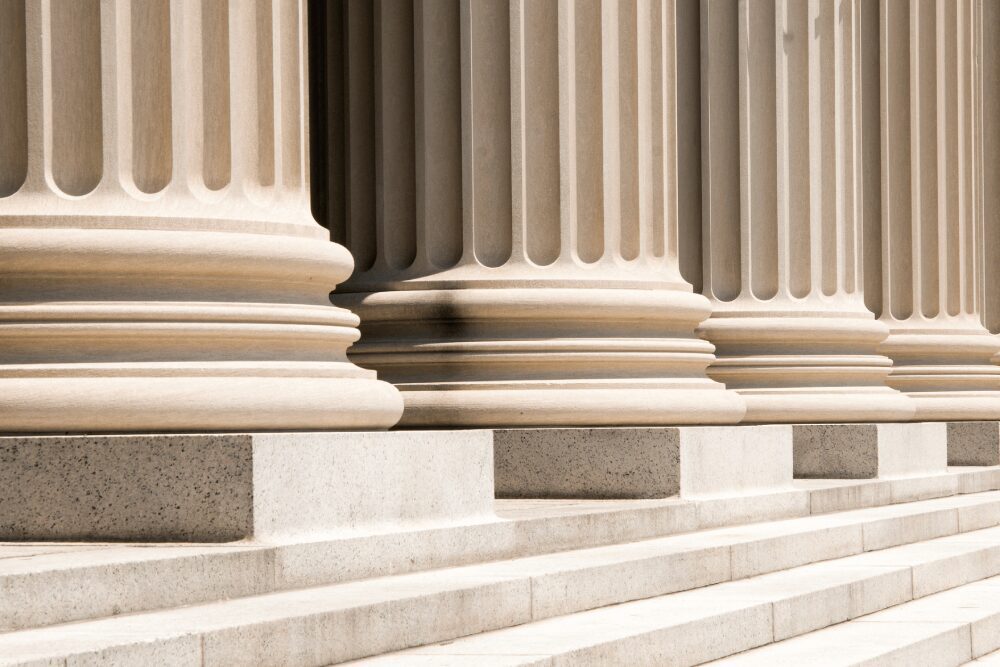 Classical stone columns with broad steps